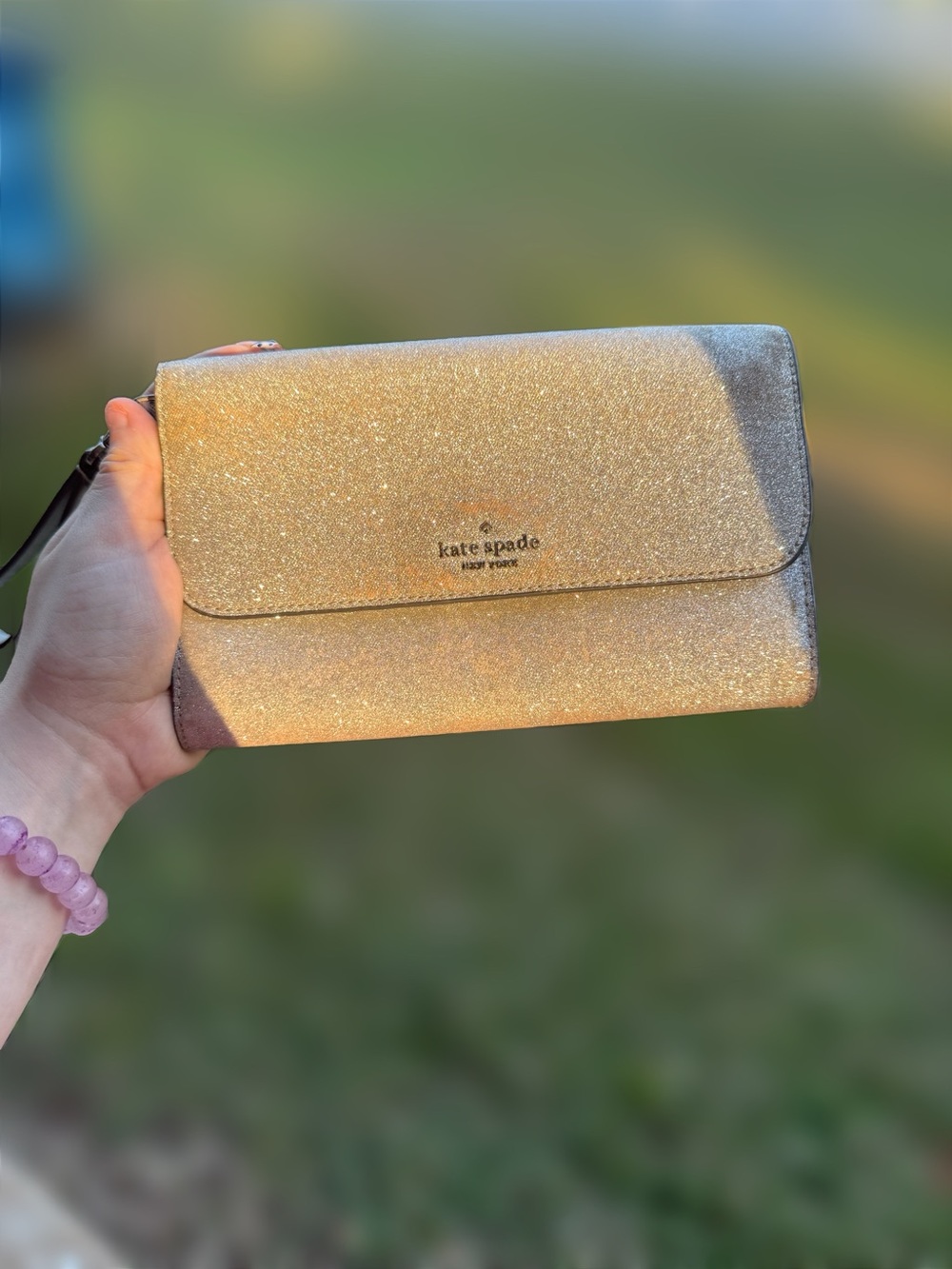 kate spade New York Silver Glitter Wristlet Clutch
